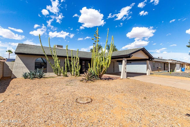 3008 W Michigan Ave, Phoenix, AZ 85053 - view of front of home featuring fence, stucco siding, an attached carport, and driveway