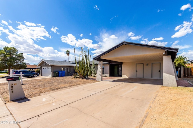 3008 W Michigan Ave, Phoenix, AZ 85053 - ranch-style house with an attached carport and concrete driveway