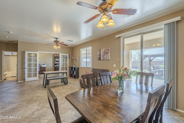 26842 N 176th Ln, Surprise, AZ 85387 - dining space with french doors, baseboards, visible vents, and ceiling fan