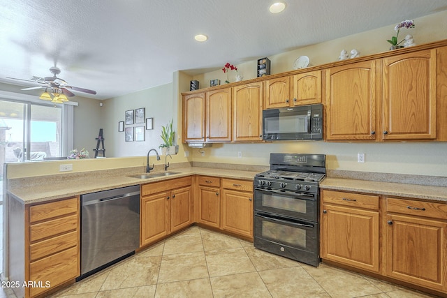 26842 N 176th Ln, Surprise, AZ 85387 - kitchen with light tile patterned floors, a peninsula, black appliances, light countertops, and a sink