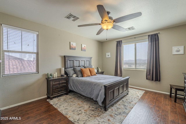 26842 N 176th Ln, Surprise, AZ 85387 - bedroom with visible vents, baseboards, a ceiling fan, and dark wood-style floors