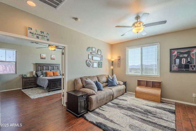26842 N 176th Ln, Surprise, AZ 85387 - living area with dark wood finished floors, visible vents, baseboards, and ceiling fan