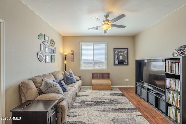 26842 N 176th Ln, Surprise, AZ 85387 - living area featuring a ceiling fan, baseboards, dark wood-style floors, and visible vents