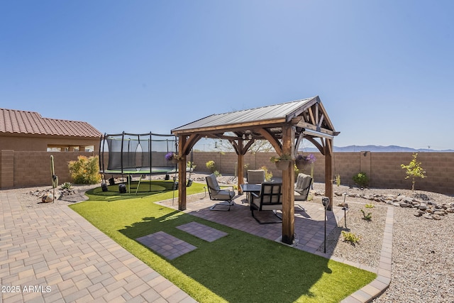 26842 N 176th Ln, Surprise, AZ 85387 - view of yard with a trampoline, a patio area, a fenced backyard, and a gazebo