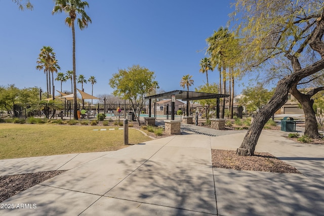 26842 N 176th Ln, Surprise, AZ 85387 - view of home's community with fence, a lawn, and a pergola