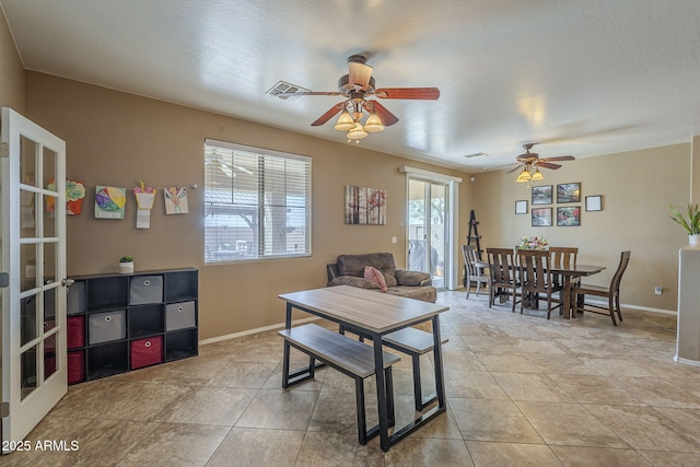 26842 N 176th Ln, Surprise, AZ 85387 - living room with light tile patterned floors, visible vents, baseboards, and ceiling fan