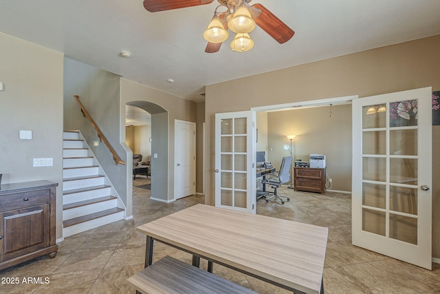 26842 N 176th Ln, Surprise, AZ 85387 - home office featuring ceiling fan, light tile patterned floors, arched walkways, french doors, and baseboards