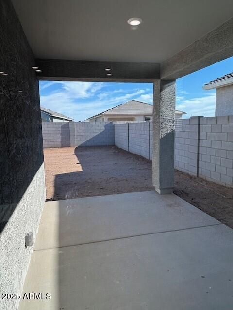 38055 W Excussare Way, Maricopa, AZ 85138 - fenced backyard with a patio