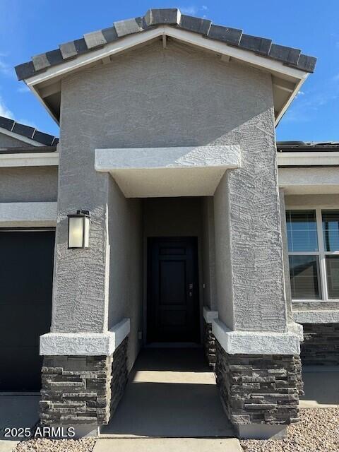 38055 W Excussare Way, Maricopa, AZ 85138 - doorway to property with stucco siding