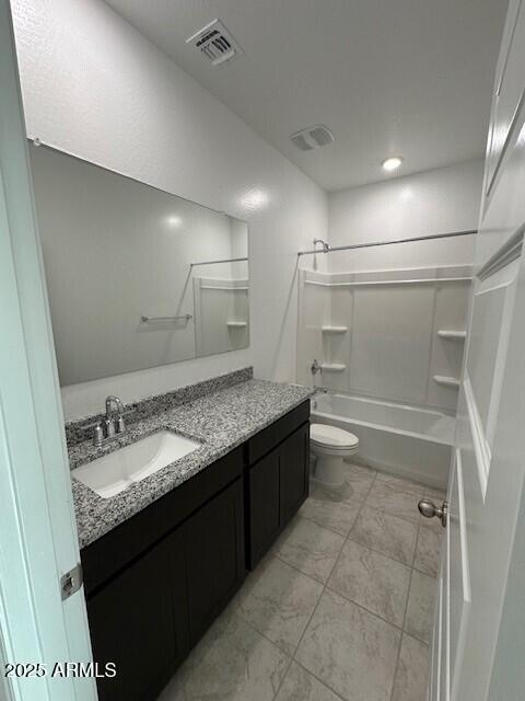 38055 W Excussare Way, Maricopa, AZ 85138 - full bathroom featuring vanity, bathtub / shower combination, and toilet