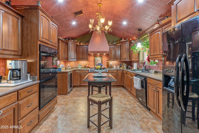 1702 W Monterosa St W, Phoenix, AZ 85015 - kitchen featuring black appliances, a sink, a chandelier, custom exhaust hood, and brown cabinets