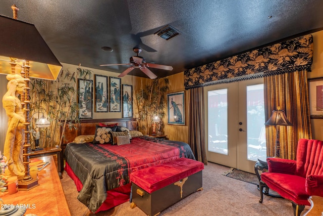 1702 W Monterosa St W, Phoenix, AZ 85015 - carpeted bedroom with access to exterior, french doors, a textured ceiling, and a ceiling fan