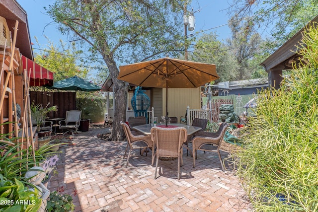 1702 W Monterosa St W, Phoenix, AZ 85015 - fenced backyard featuring a patio and outdoor dining area