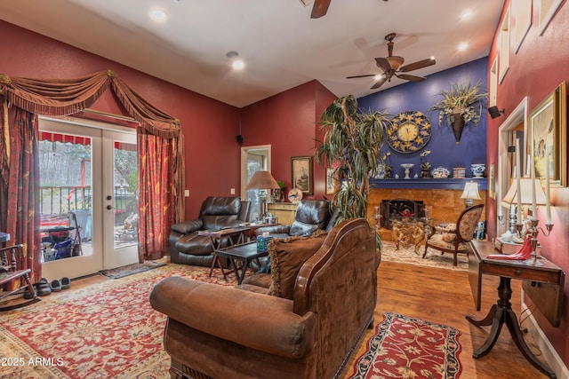 1702 W Monterosa St W, Phoenix, AZ 85015 - living room with french doors, ceiling fan, wood finished floors, a fireplace, and recessed lighting