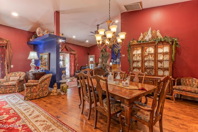 1702 W Monterosa St W, Phoenix, AZ 85015 - dining space with vaulted ceiling, hardwood / wood-style floors, a chandelier, and recessed lighting