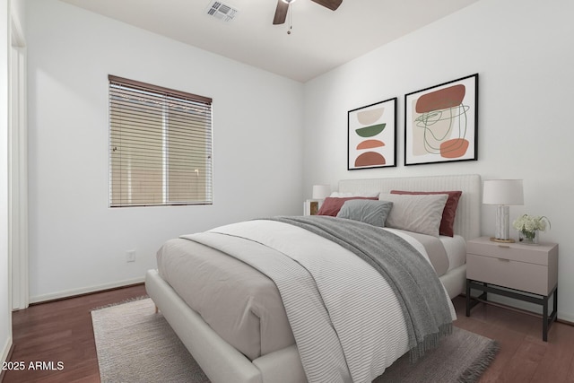 bedroom with ceiling fan and dark hardwood / wood-style flooring