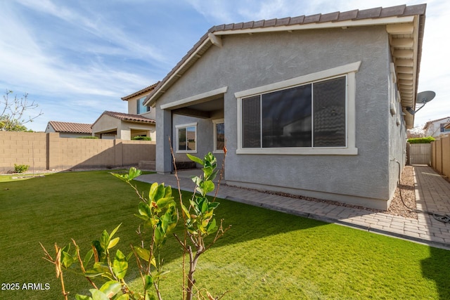 rear view of property with a yard