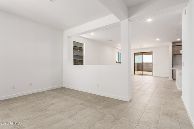 spare room featuring recessed lighting, baseboards, and light tile patterned flooring