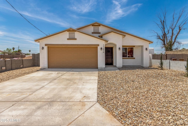 11474 N 79th Dr, Peoria, AZ 85345 - view of front of home with stucco siding, driveway, and an attached garage