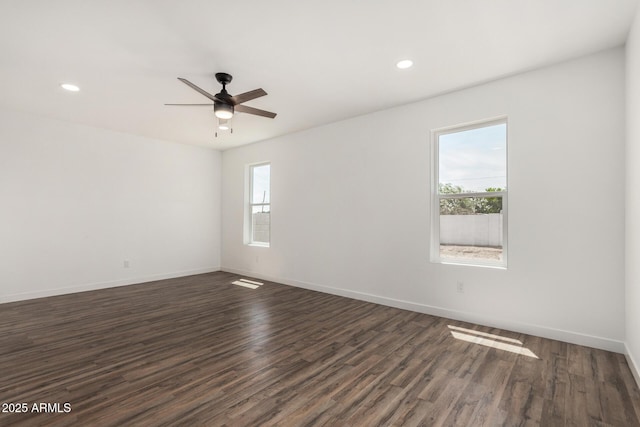 11474 N 79th Dr, Peoria, AZ 85345 - spare room featuring healthy amount of natural light, dark wood-style floors, recessed lighting, ceiling fan, and baseboards