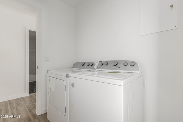 11474 N 79th Dr, Peoria, AZ 85345 - laundry area with washer and dryer, light wood-style flooring, and baseboards