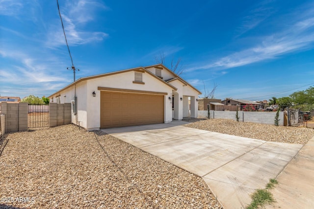 11474 N 79th Dr, Peoria, AZ 85345 - single story home featuring a gate, stucco siding, an attached garage, and driveway
