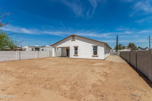 11474 N 79th Dr, Peoria, AZ 85345 - rear view of house featuring stucco siding and a fenced backyard