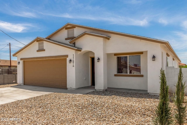 11474 N 79th Dr, Peoria, AZ 85345 - view of front facade featuring an attached garage, driveway, and stucco siding
