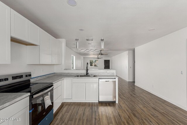 11474 N 79th Dr, Peoria, AZ 85345 - kitchen with dishwasher, electric range, a sink, a peninsula, and open floor plan