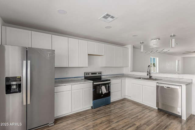 11474 N 79th Dr, Peoria, AZ 85345 - kitchen with appliances with stainless steel finishes, a sink, light countertops, and wood finished floors