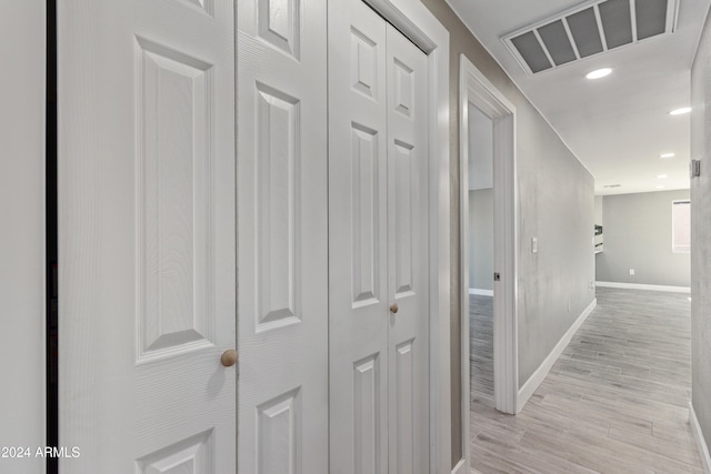 corridor featuring light hardwood / wood-style floors