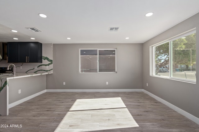 interior space featuring sink and light hardwood / wood-style flooring