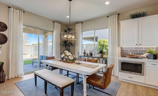 16342 W Jackson St, Goodyear, AZ 85338 - dining area featuring light wood finished floors, recessed lighting, and a chandelier