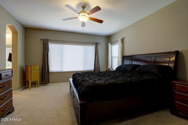 bedroom with light carpet and ceiling fan