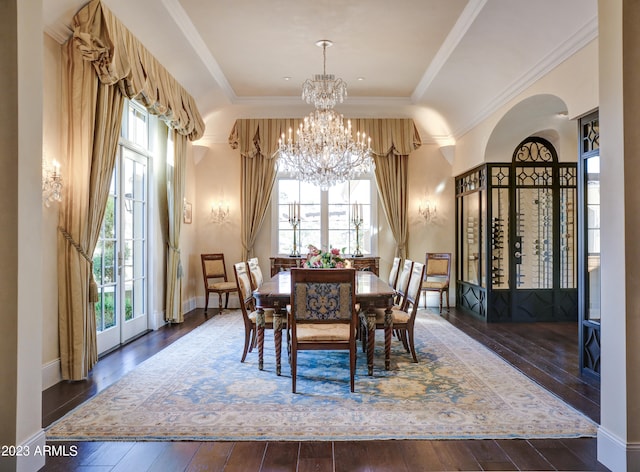 dining space featuring an inviting chandelier, dark wood-type flooring, and a wealth of natural light