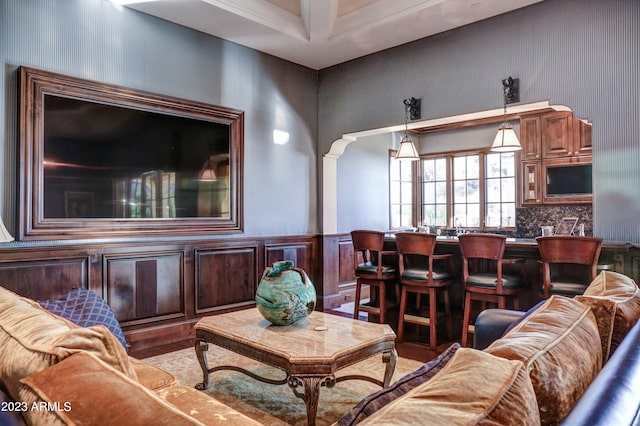 living room with wood-type flooring and bar area