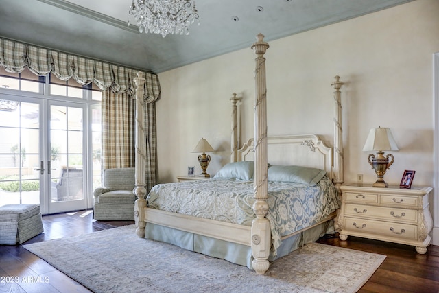 bedroom with a notable chandelier, dark hardwood / wood-style floors, access to exterior, and crown molding