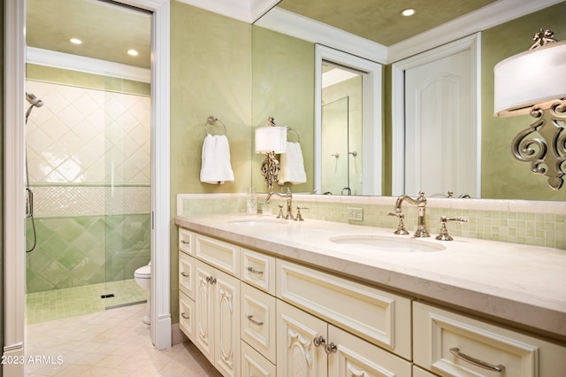 bathroom featuring vanity, a shower, toilet, and tile patterned floors