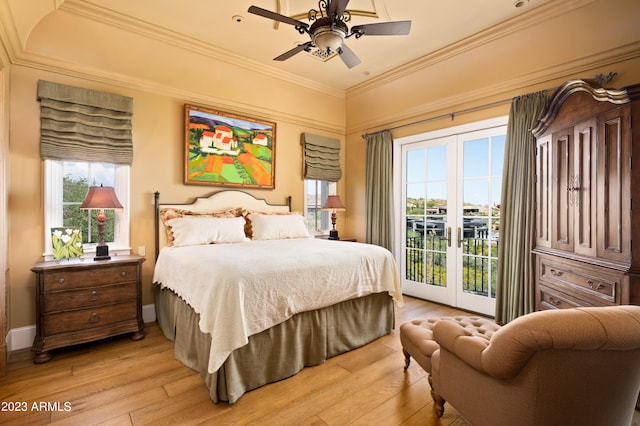 bedroom featuring ceiling fan, light hardwood / wood-style flooring, french doors, and access to exterior