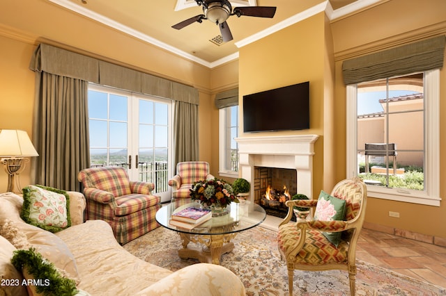 living room featuring ornamental molding, ceiling fan, and french doors