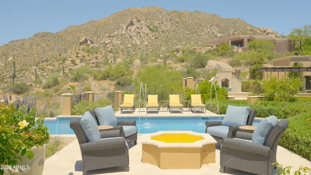 view of patio featuring a mountain view and pool water feature