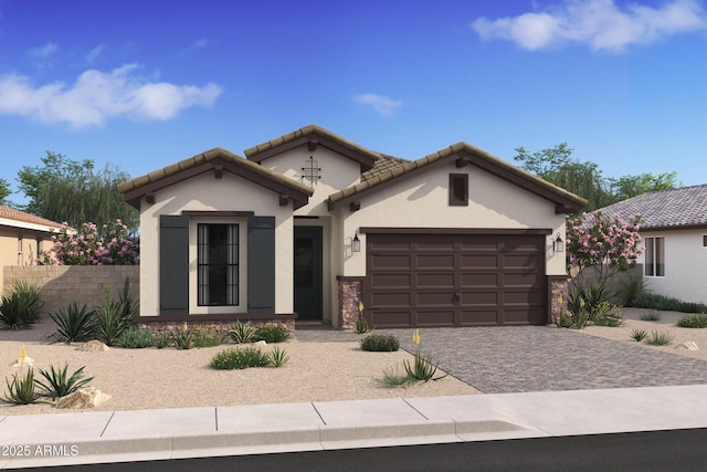 view of front of house featuring an attached garage, stone siding, a tiled roof, decorative driveway, and stucco siding