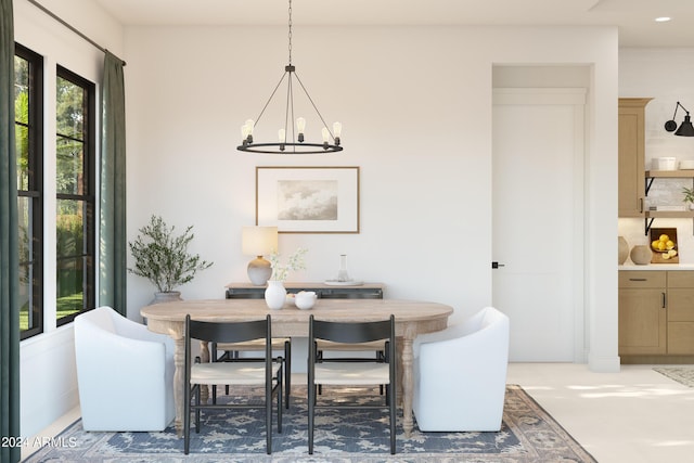 dining area with a notable chandelier and recessed lighting