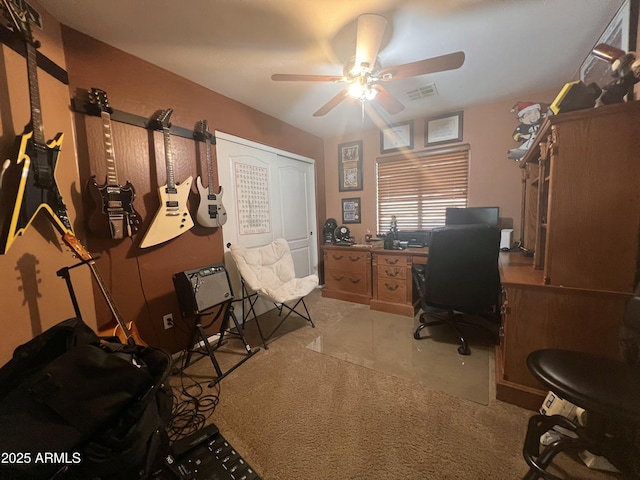 office with light colored carpet and ceiling fan