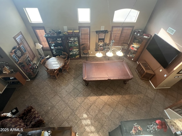 living room featuring a towering ceiling