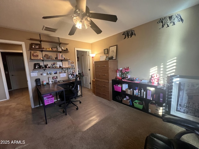 office with carpet flooring and ceiling fan