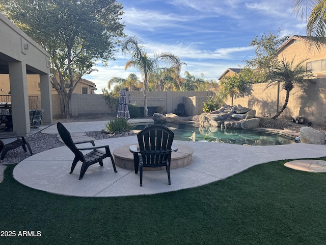 view of patio / terrace with a fenced in pool