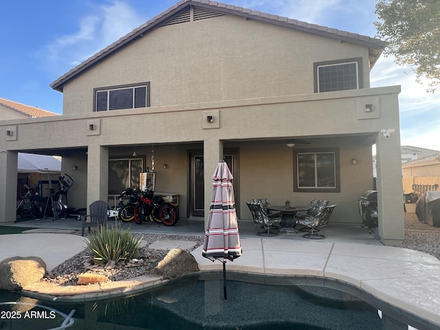 back of house featuring a patio area