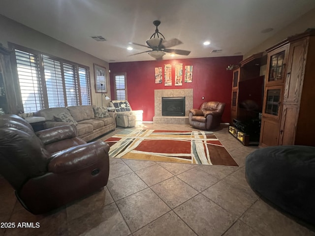 tiled living room featuring ceiling fan