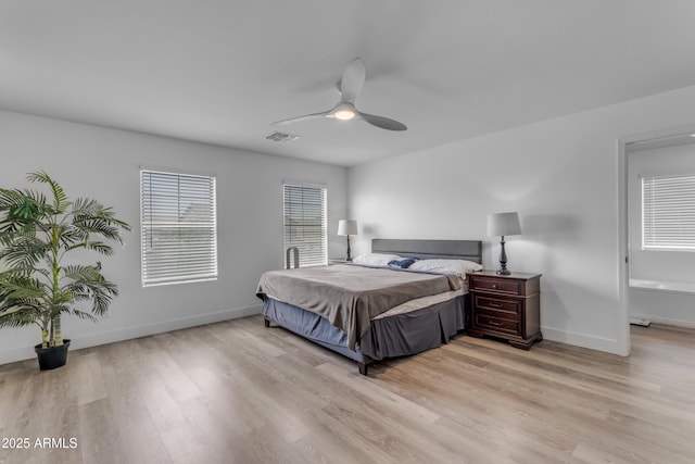 bedroom with light wood-style floors, baseboards, a ceiling fan, and visible vents